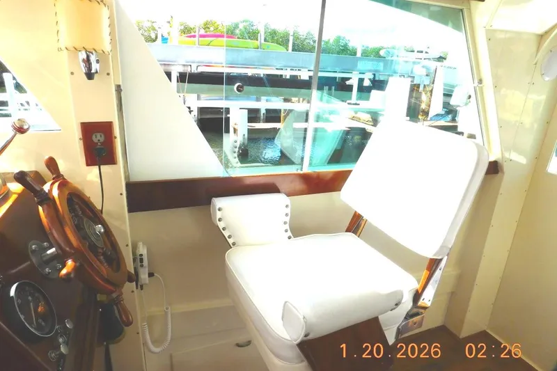Slide: The Image of Starboard salon with Ladderback helm Chair at lower helm - 11