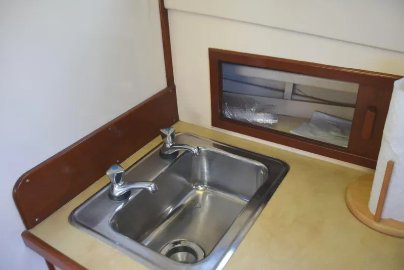 Slide: The Image of Stainless sink and storage behind - 19