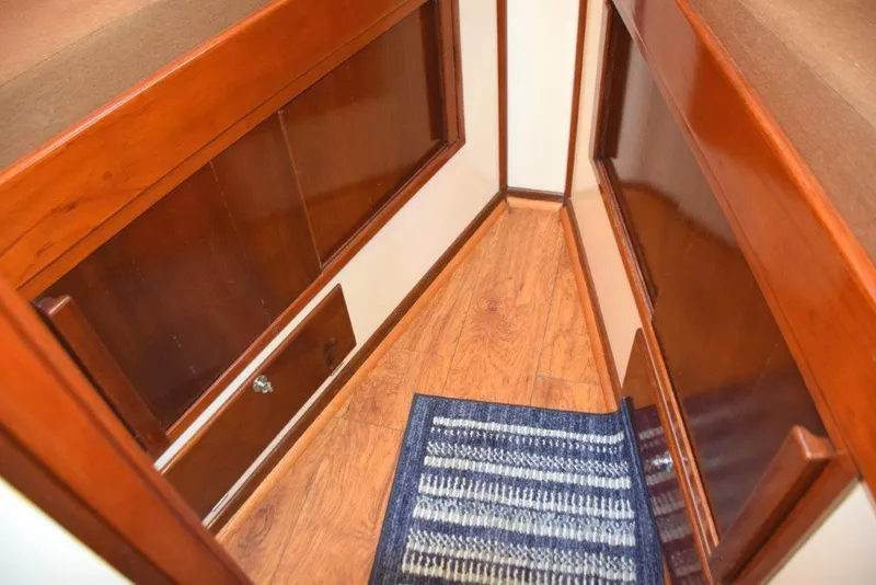 Slide: The Image of Laminate wood sole. Cabinets and drawers below the V-berth - 25