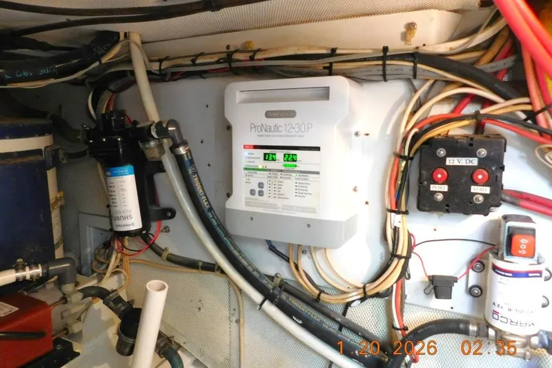 Slide: The Image of Water heater to port, fresh water pump, New Battery charger - 59