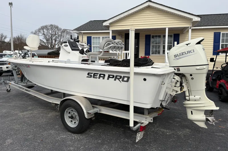 Slide: The Image of 2018 Sea Pro 208 Bay boat on trailer with Suzuki outboard motor. - 1