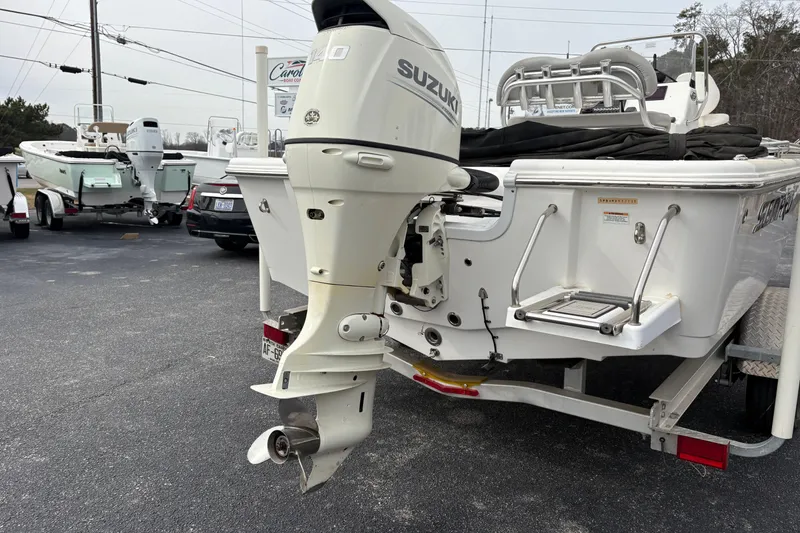 Slide: The Image of 2018 Sea Pro 208 Bay boat with Suzuki outboard motor on trailer. - 4