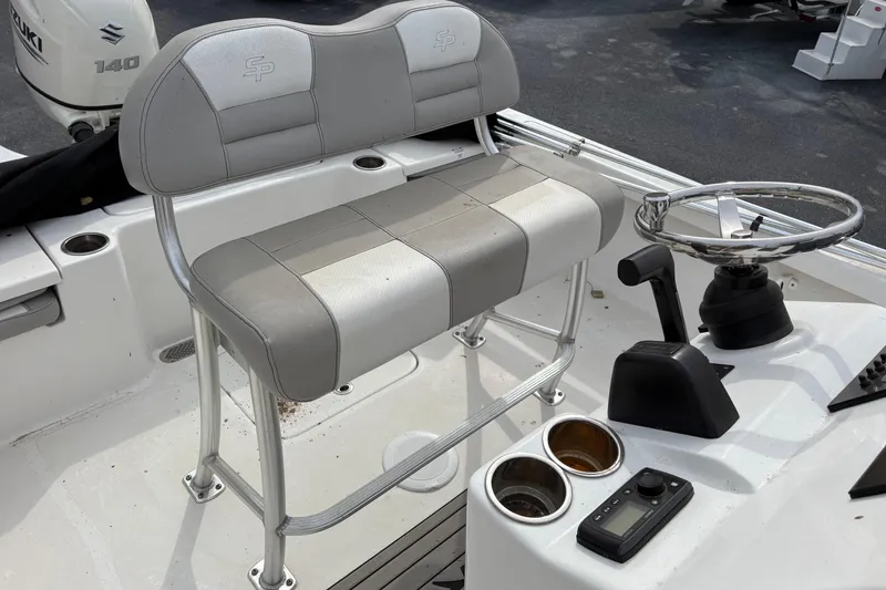 Slide: The Image of 2018 Sea Pro 208 Bay boat interior with steering wheel and seating. - 6