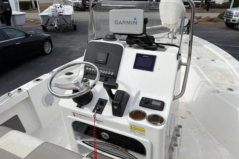 Slide: The Image of 2018 Sea Pro 208 Bay boat dashboard with Garmin navigation system and steering wheel. - 7