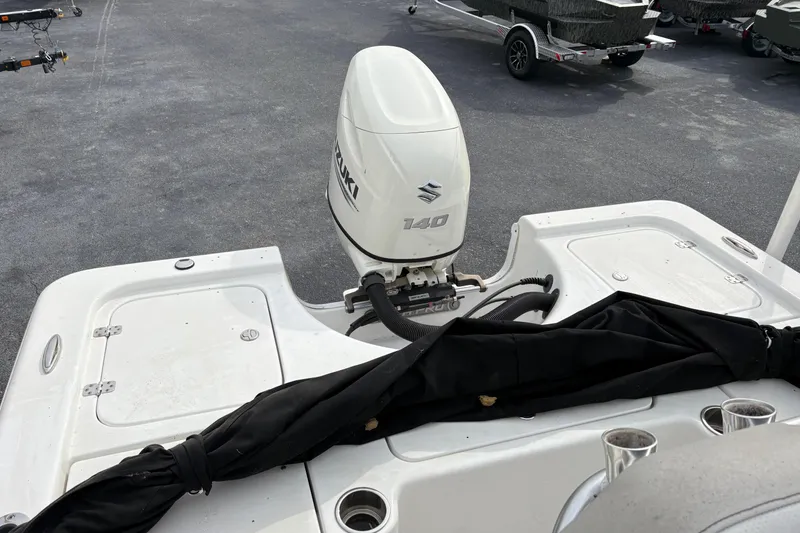 Slide: The Image of 2018 Sea Pro 208 Bay boat with Suzuki 140 outboard motor in parking lot. - 9