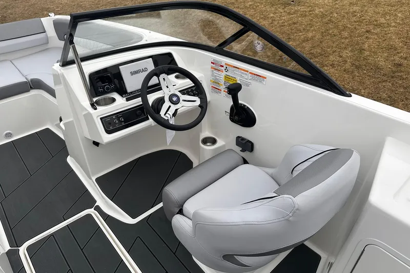 Slide: The Image of 2026 Bayliner D22 boat interior with steering wheel and control panel. - 10