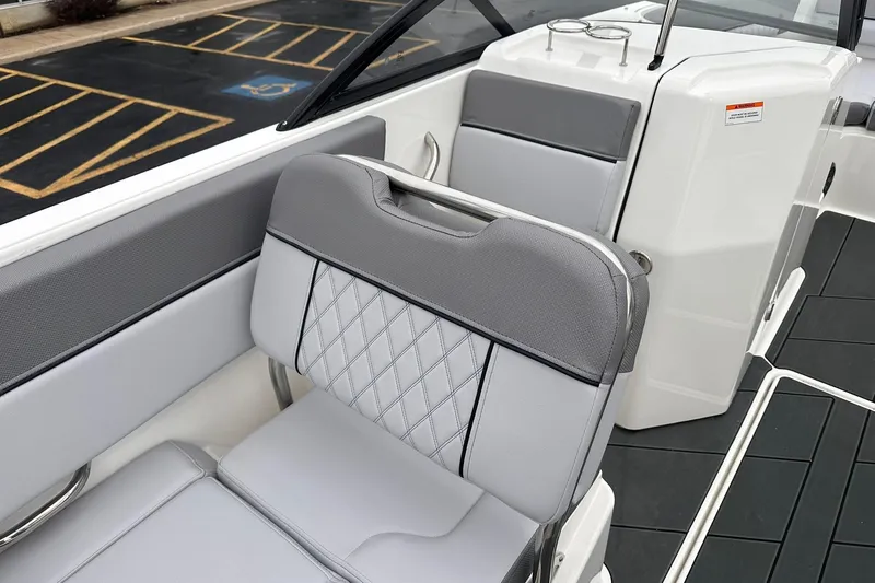 Slide: The Image of 2026 Bayliner D22 boat interior with gray cushioned seating and modern design. - 14