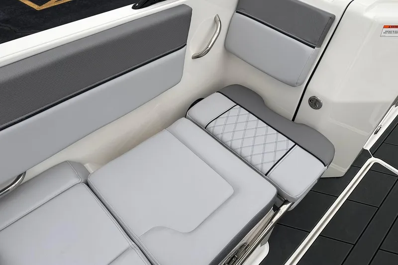 Slide: The Image of 2026 Bayliner D22 boat interior with gray cushioned seating and sleek design. - 15