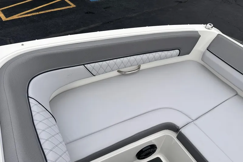 Slide: The Image of Luxurious seating area of 2026 Bayliner D22 boat with gray and white upholstery. - 19