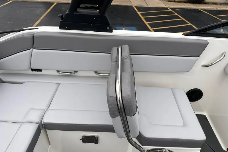 Slide: The Image of 2026 Bayliner D22 boat interior with gray seating and stainless steel accents. - 21
