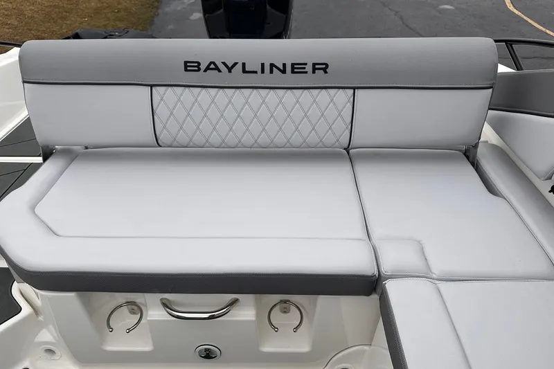 Slide: The Image of 2026 Bayliner D22 boat seating with gray upholstery and diamond pattern design. - 24