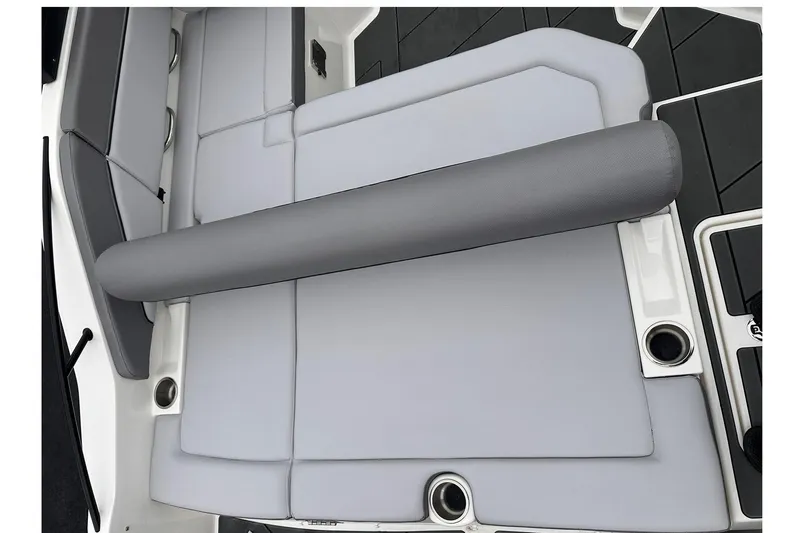 Slide: The Image of 2026 Bayliner D22 boat interior with gray cushioned seating and cup holders. - 28