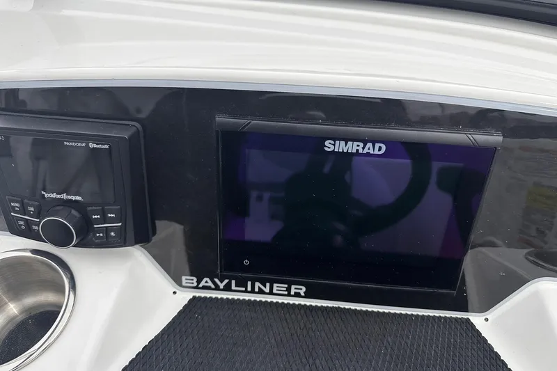 Slide: The Image of 2026 Bayliner D22 dashboard with Simrad display and Rockford Fosgate audio system. - 32