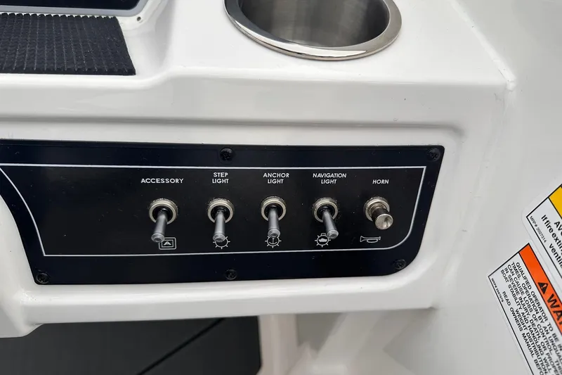 Slide: The Image of Control panel of 2026 Bayliner D22 boat with switches for lights and horn. - 34