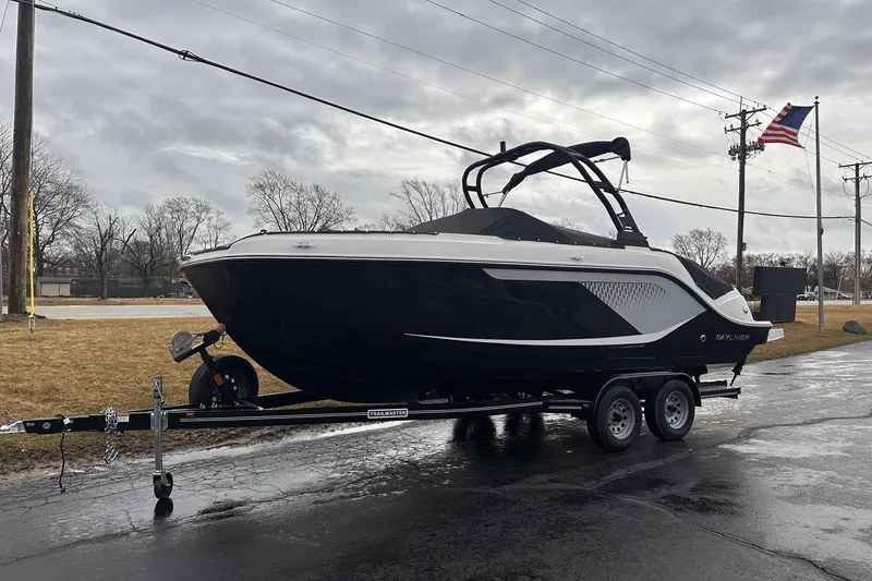 Slide: The Image of 2026 Bayliner D22 boat on trailer, parked outdoors on a cloudy day. - 42