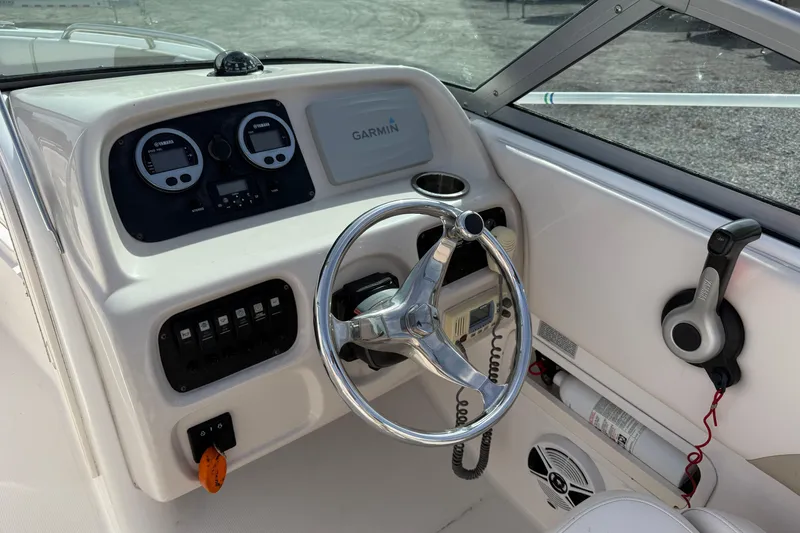Slide: The Image of 2026 Robalo R277 Dual Console boat dashboard with Garmin navigation and Yamaha controls. - 7