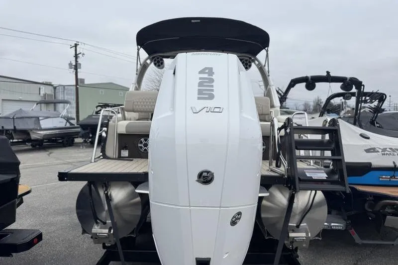 Slide: The Image of 2026 Avalon 2585 27-3 Excalibur LTD QLS with Mercury 425 V10 engine, docked outdoors. - 17