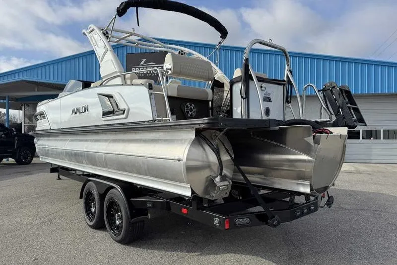 Slide: The Image of 2026 Avalon 2585 27-3 Excalibur LTD QLS pontoon boat on display at dealership. - 6