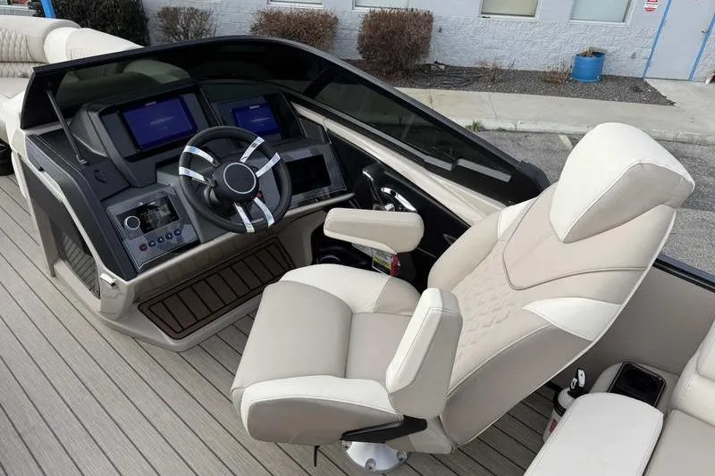 Slide: The Image of 2026 Avalon 2585 27-3 Excalibur LTD QLS boat dashboard with modern controls and displays. - 7