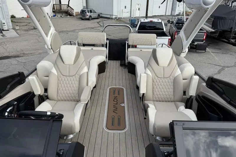 Slide: The Image of Luxurious 2026 Avalon 2585 27-3 Excalibur LTD QLS pontoon boat interior with plush seating. - 9
