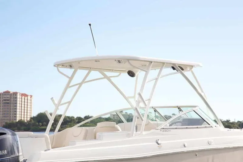 Slide: The Image of Manufacturer Provided Image: 2026 World Cat 230 SD boat with sleek design and modern features, docked near shoreline. - 7