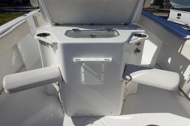 Slide: The Image of 2022 Sea Hunt Ultra 234 boat interior with seating and storage compartments. - 13