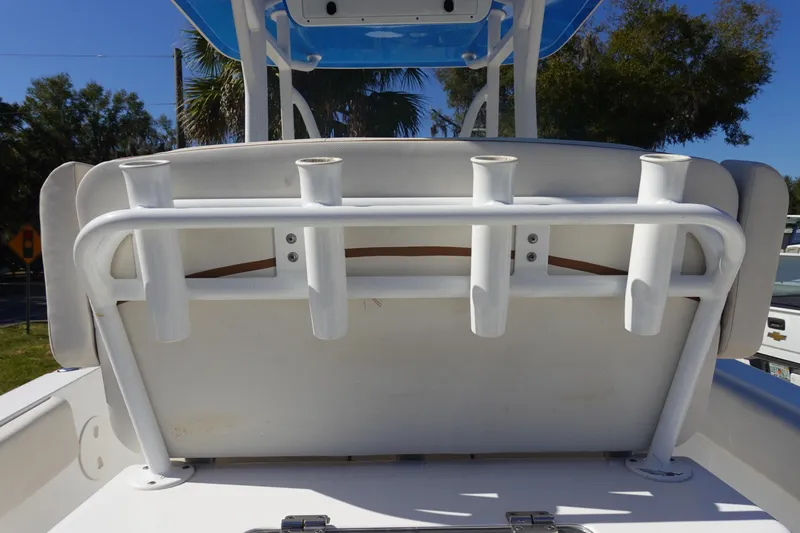 Slide: The Image of 2022 Sea Hunt Ultra 234 boat with rod holders and seating, outdoor view. - 15