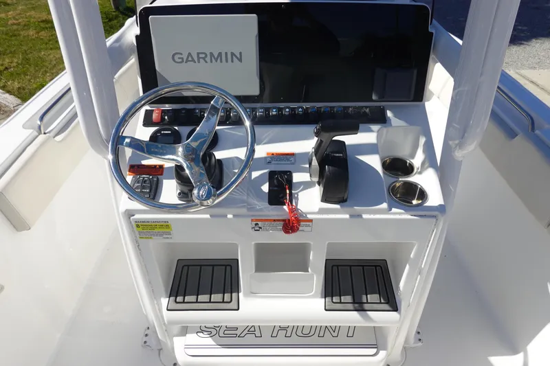Slide: The Image of 2022 Sea Hunt Ultra 234 boat console with Garmin display and steering wheel. - 20