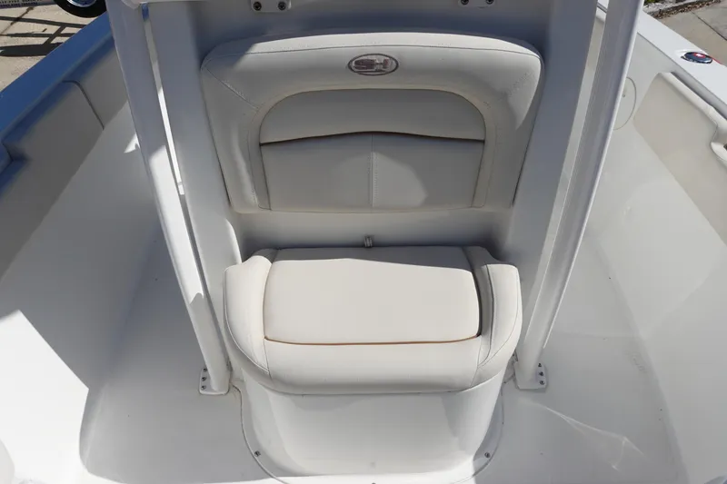 Slide: The Image of 2022 Sea Hunt Ultra 234 boat seat with white upholstery and sleek design. - 25