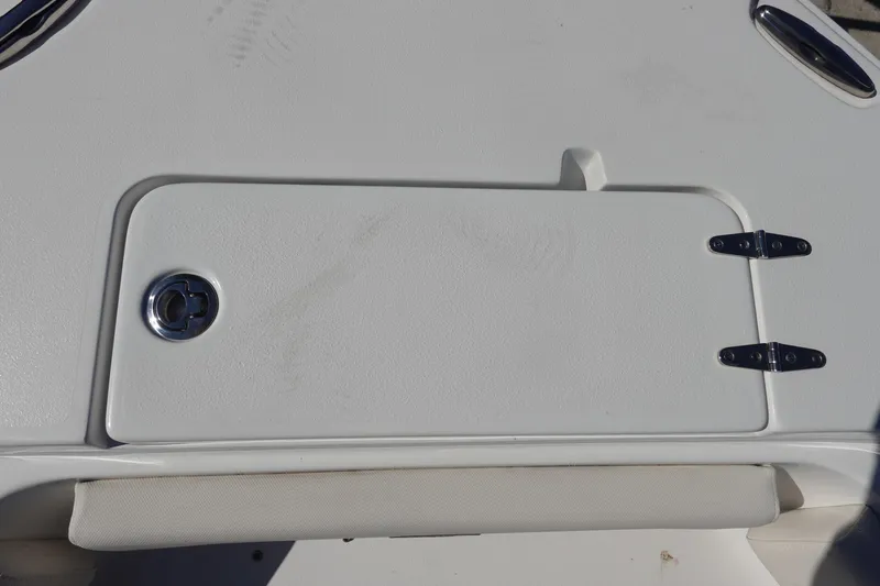 Slide: The Image of 2022 Sea Hunt Ultra 234 boat hatch with chrome latch and hinges. - 33