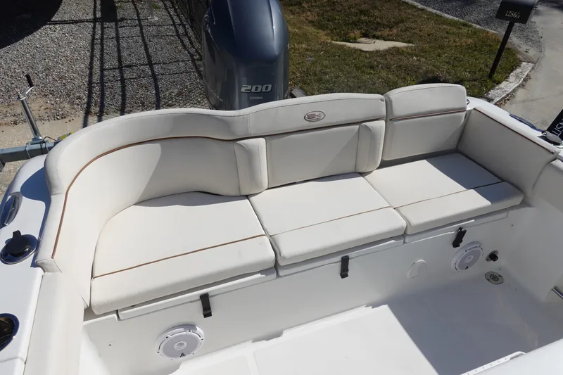 Slide: The Image of 2022 Sea Hunt Ultra 234 boat with cushioned seating and Yamaha 200 engine. - 6