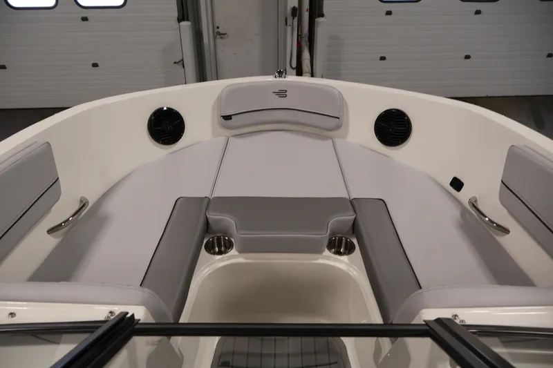 Slide: The Image of 2026 Bayliner VR6 Bowrider I/O interior with gray seating and cup holders. - 10