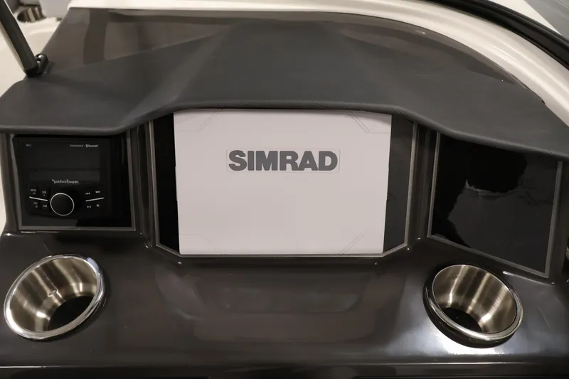 Slide: The Image of Dashboard of 2026 Bayliner VR6 Bowrider I/O with Simrad display and cup holders. - 16