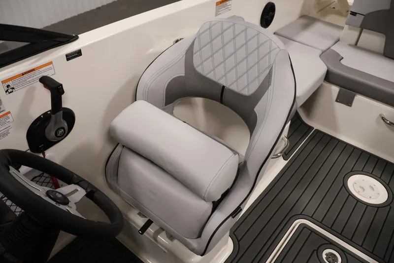 Slide: The Image of 2026 Bayliner VR6 Bowrider I/O interior with modern helm and cushioned seating. - 24