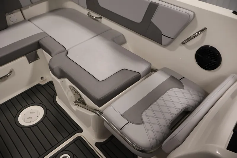 Slide: The Image of 2026 Bayliner VR6 Bowrider I/O interior seating with gray upholstery and sleek design. - 28