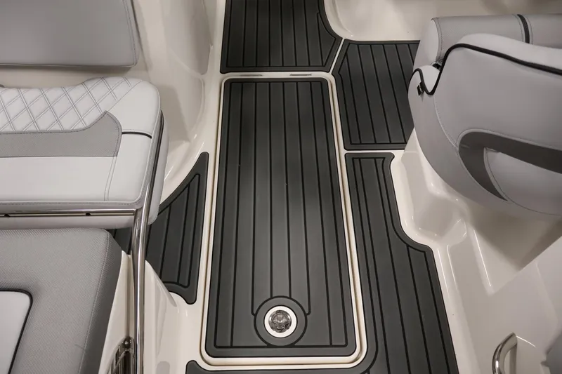 Slide: The Image of 2026 Bayliner VR6 Bowrider I/O interior with sleek seating and non-slip flooring. - 29