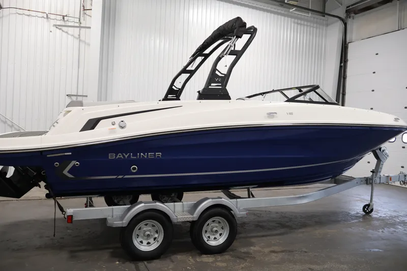 Slide: The Image of 2026 Bayliner VR6 Bowrider I/O on trailer in indoor setting. - 3