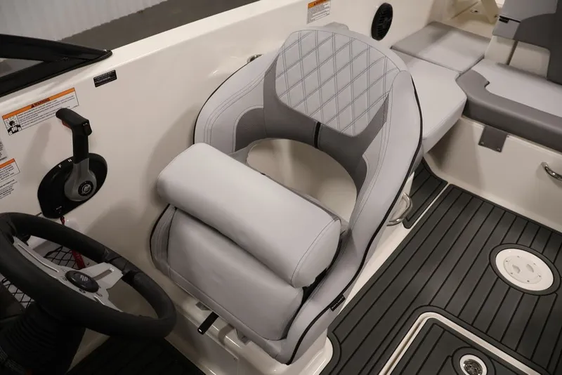 Slide: The Image of 2026 Bayliner VR6 Bowrider I/O interior with modern helm seat and sleek design. - 19