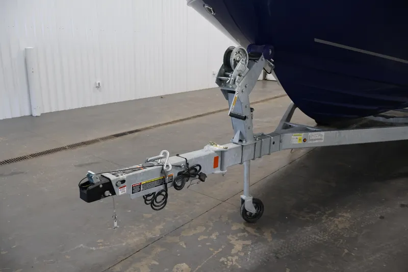 Slide: The Image of 2026 Bayliner VR6 Bowrider I/O on trailer, showcasing hitch and front wheel. - 38