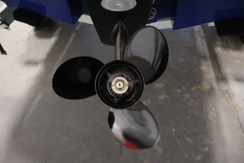 Slide: The Image of Close-up of a 2026 Bayliner VR6 Bowrider I/O boat propeller. - 31