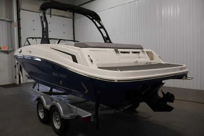 Slide: The Image of 2026 Bayliner VR6 Bowrider I/O boat on trailer in indoor storage. - 6