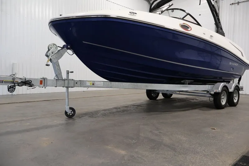 Slide: The Image of 2026 Bayliner VR6 Bowrider I/O on trailer in indoor setting. - 38