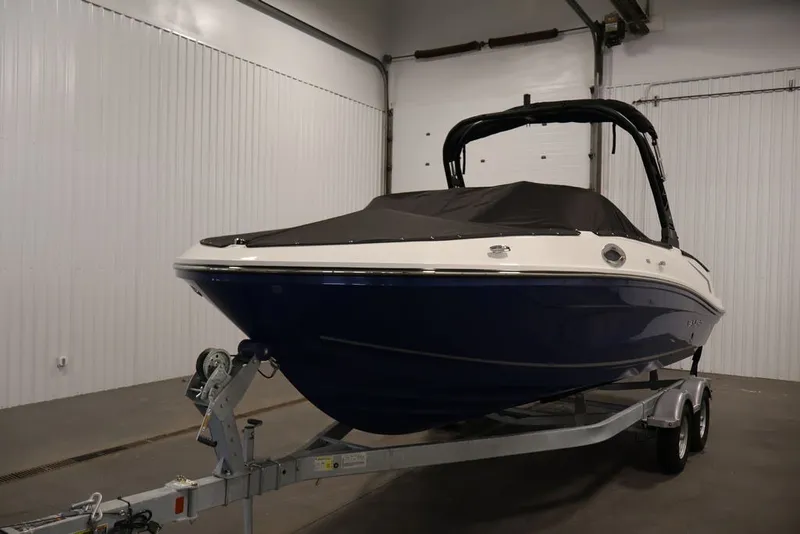 Slide: The Image of 2026 Bayliner VR6 Bowrider I/O boat on trailer in indoor storage. - 46