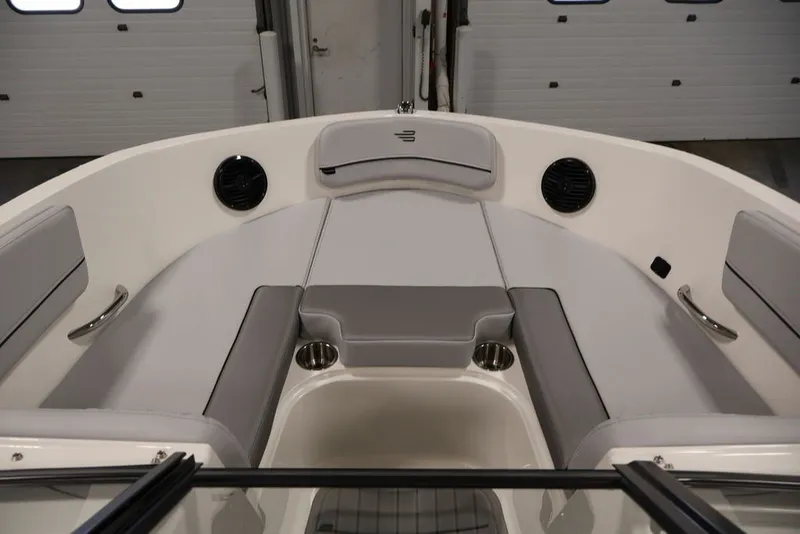 Slide: The Image of 2026 Bayliner VR6 Bowrider I/O interior with gray seating and cup holders. - 17
