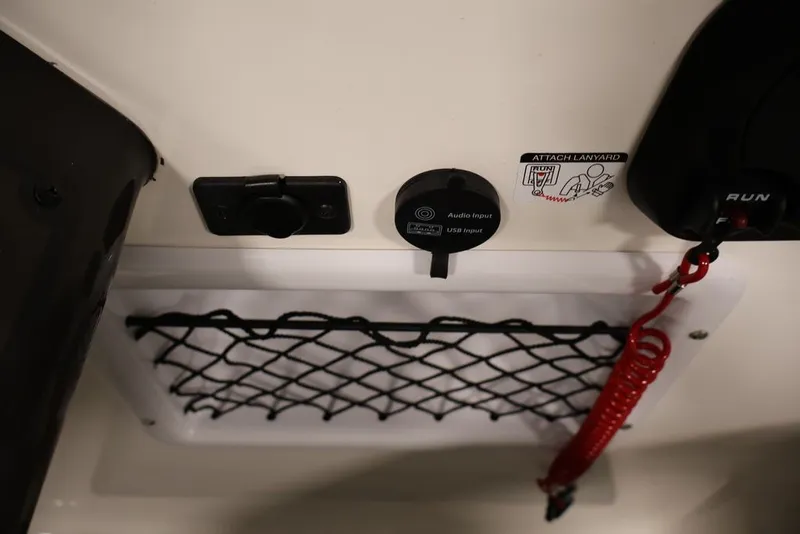 Slide: The Image of 2026 Bayliner VR6 Bowrider I/O dashboard with audio input, USB port, and safety lanyard. - 30