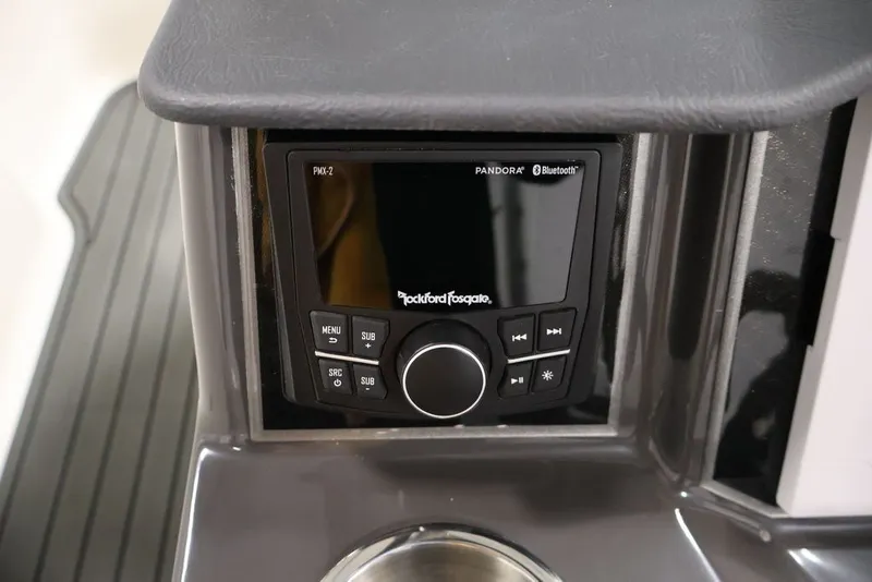 Slide: The Image of 2026 Bayliner VR6 Bowrider I/O dashboard featuring Rockford Fosgate PMX-2 audio system with Bluetooth. - 42
