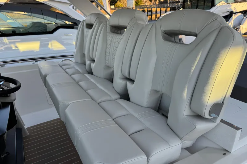 Slide: The Image of Luxurious seating on 2025 Tiara Yachts 38 LS, featuring elegant white leather upholstery. - 12