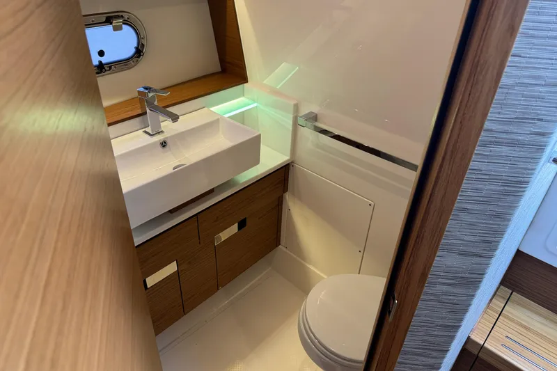 Slide: The Image of Luxurious bathroom in 2025 Tiara Yachts 38 LS, featuring modern sink and toilet. - 15