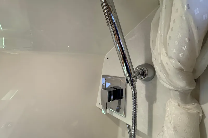 Slide: The Image of Luxury shower fixture in 2025 Tiara Yachts 38 LS, featuring modern chrome design. - 16