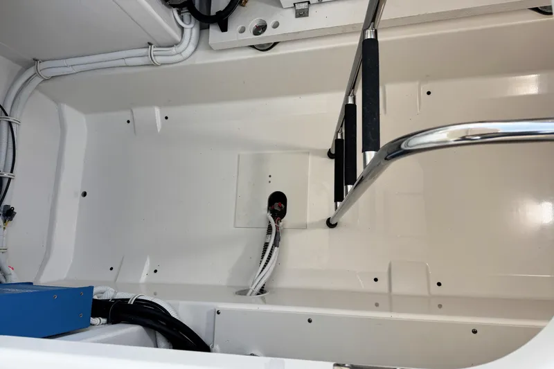 Slide: The Image of Engine compartment of 2025 Tiara Yachts 38 LS, showcasing clean design and wiring. - 23